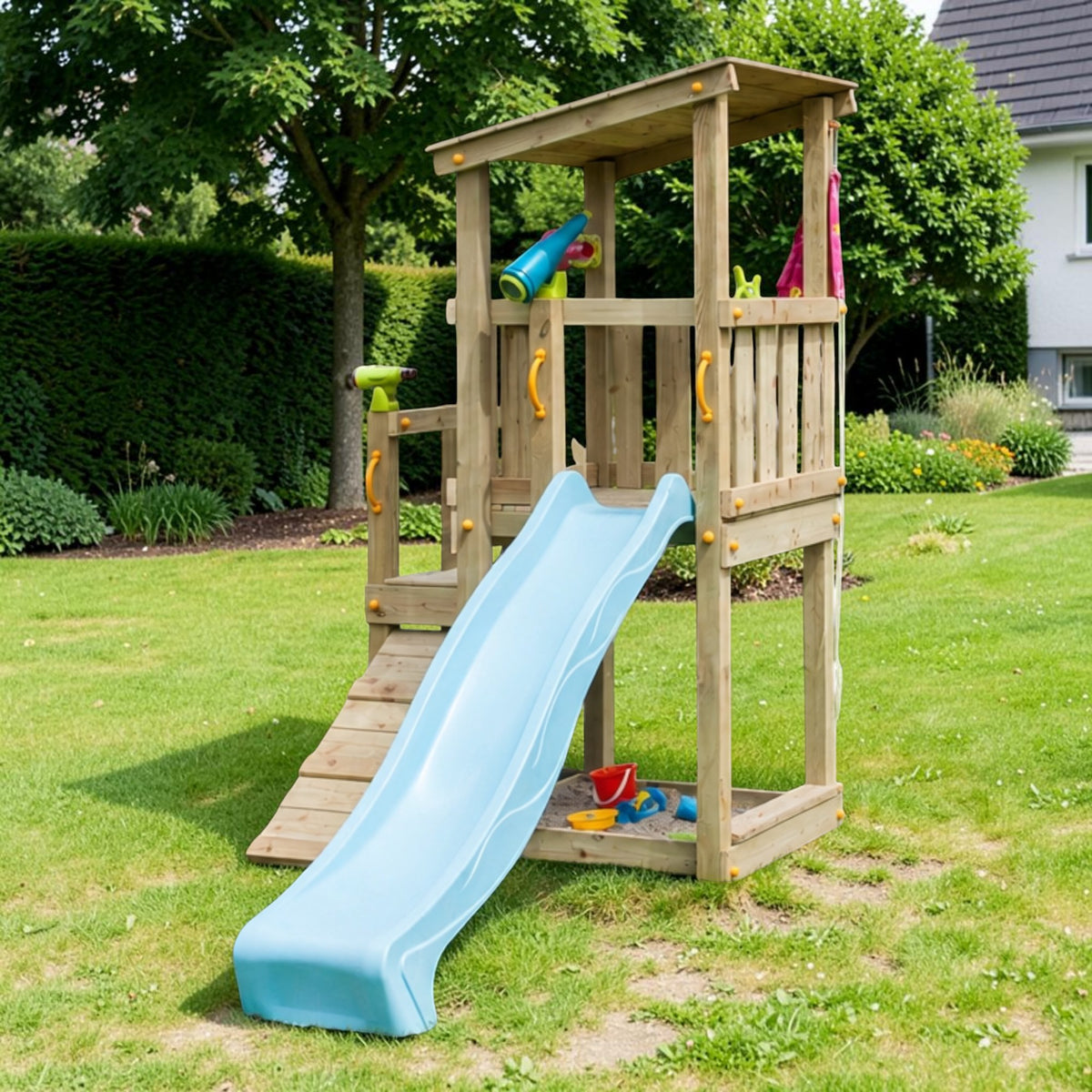 Gartenholz.org Altena wooden play tower with a blue slide, climbing ramp, and sandpit area for garden play.