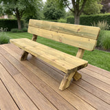 Gartenholz.org Hennetal garden bench made of green pressure-treated softwood on a wooden deck in a garden setting.