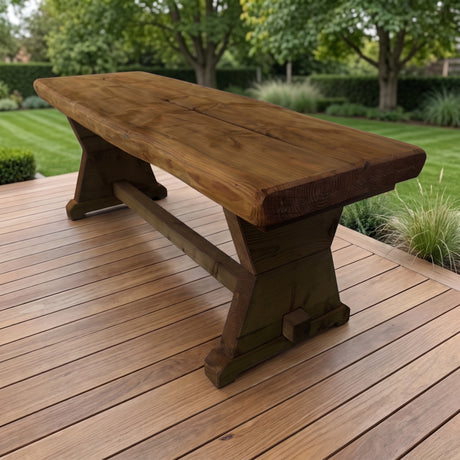Gartenholz.org Sorpetal garden table made of pressure-treated Douglas fir wood on a wooden patio in a green garden.