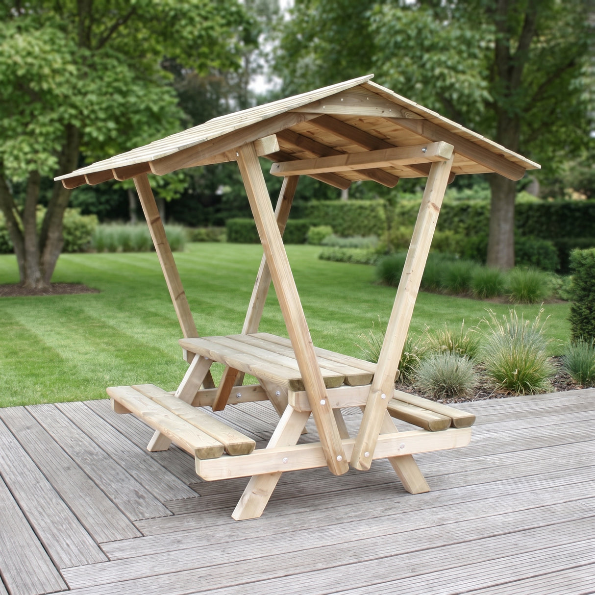 Gartenholz.org pressure-treated wooden picnic table with a protective roof and integrated benches on a patio.
