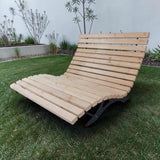 Gartenholz.org natural Douglas fir wood lounger with curved design and fixed base, perfect for outdoor relaxation.